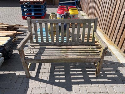 Lot 2247 - Weathered 2 seater garden bench together with...
