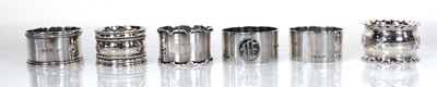 Lot 236 - Six silver napkin rings, various dates and...