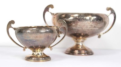 Lot 240 - A pair of graduated silver two handled trophy...