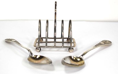 Lot 243 - A silver four slice toast rack of arched form,...