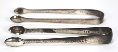 Lot 248 - Two pairs of silver old English pattern sugar...