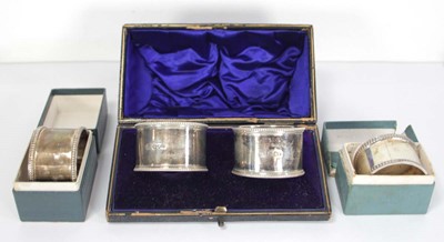 Lot 271 - A cased pair of silver napkin rings, William...