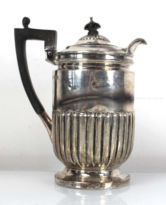 Lot 283 - An Edwardian silver hot water jug with...