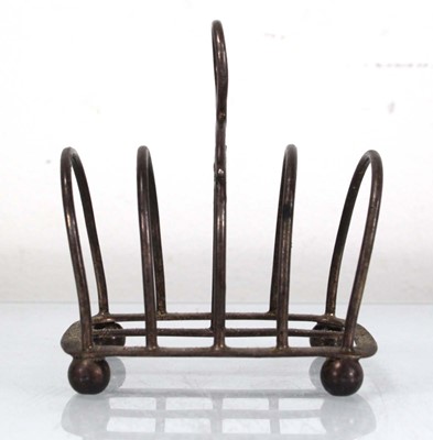 Lot 297 - A late Victorian silver four slice toast rack,...