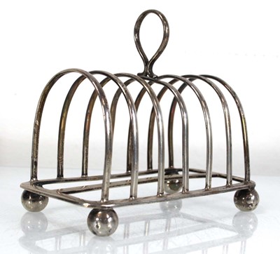 Lot 298 - An Edwardian silver six slice toast rack,...