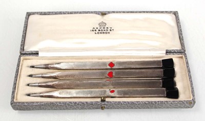Lot 303 - A cased set of four silver, engine turned and...