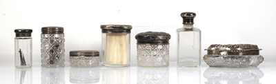 Lot 308 - Seven early 20th century silver lidded glass...
