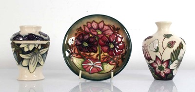 Lot 182 - A miniature Moorcroft vase of baluster form...