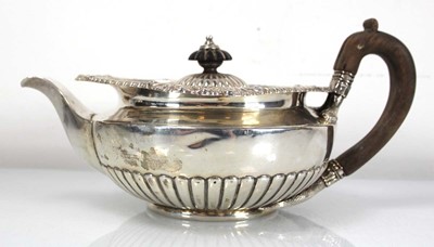 Lot 312 - A George III silver teapot of squat form with...