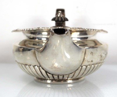 Lot 312 - A George III silver teapot of squat form with...