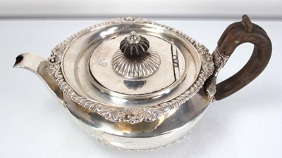 Lot 312 - A George III silver teapot of squat form with...