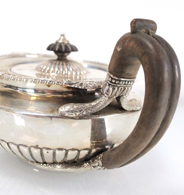 Lot 312 - A George III silver teapot of squat form with...
