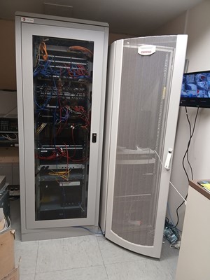 Lot 274 - 2 freestanding server racks comprising of...