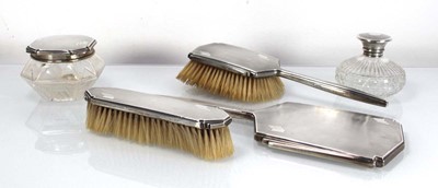 Lot 316 - A silver engine turned four piece dressing...