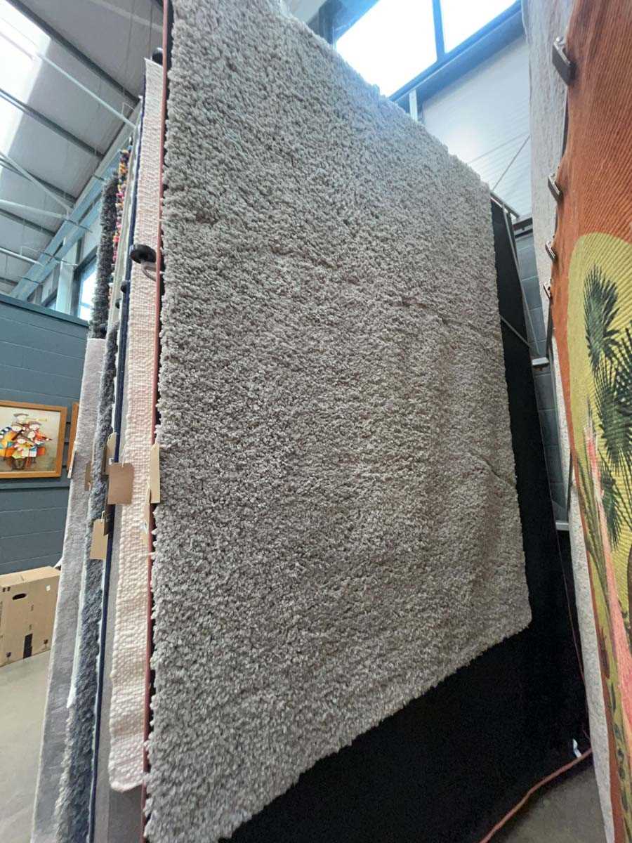 Lot 5028 - Large bobble styled rug in grey