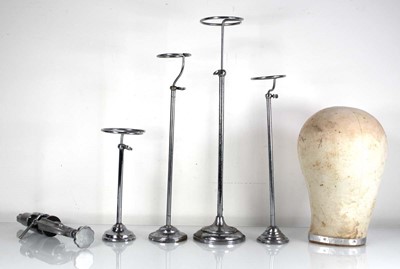 Lot 49 - Four chrome finish adjustable hat stands, a...