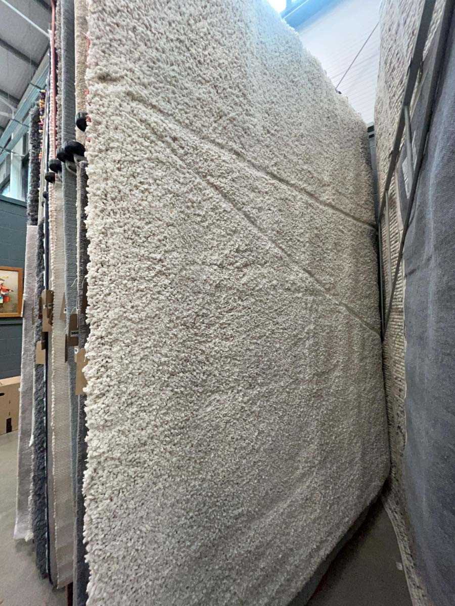Lot 5041 - Large modern off white bobble style rug