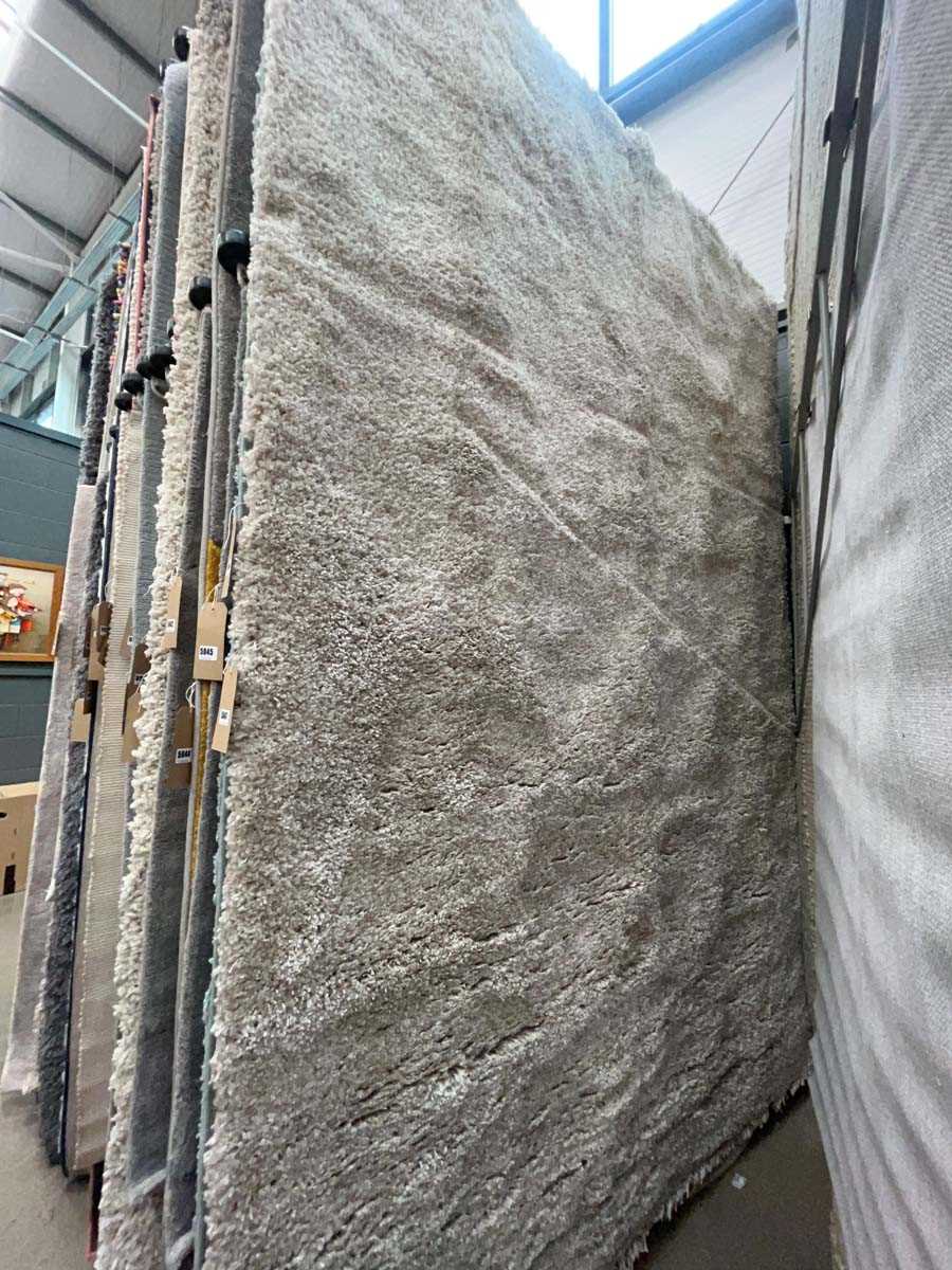 Lot 5047 - Large modern beige shag pile style rug