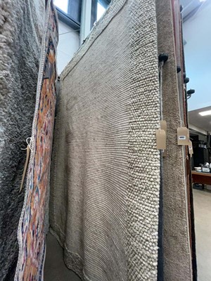 Lot 5049 - Large modern rug in off white with bobble...