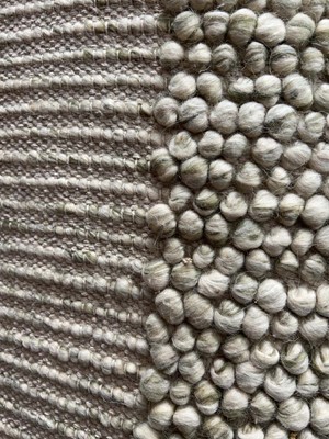 Lot 5049 - Large modern rug in off white with bobble...