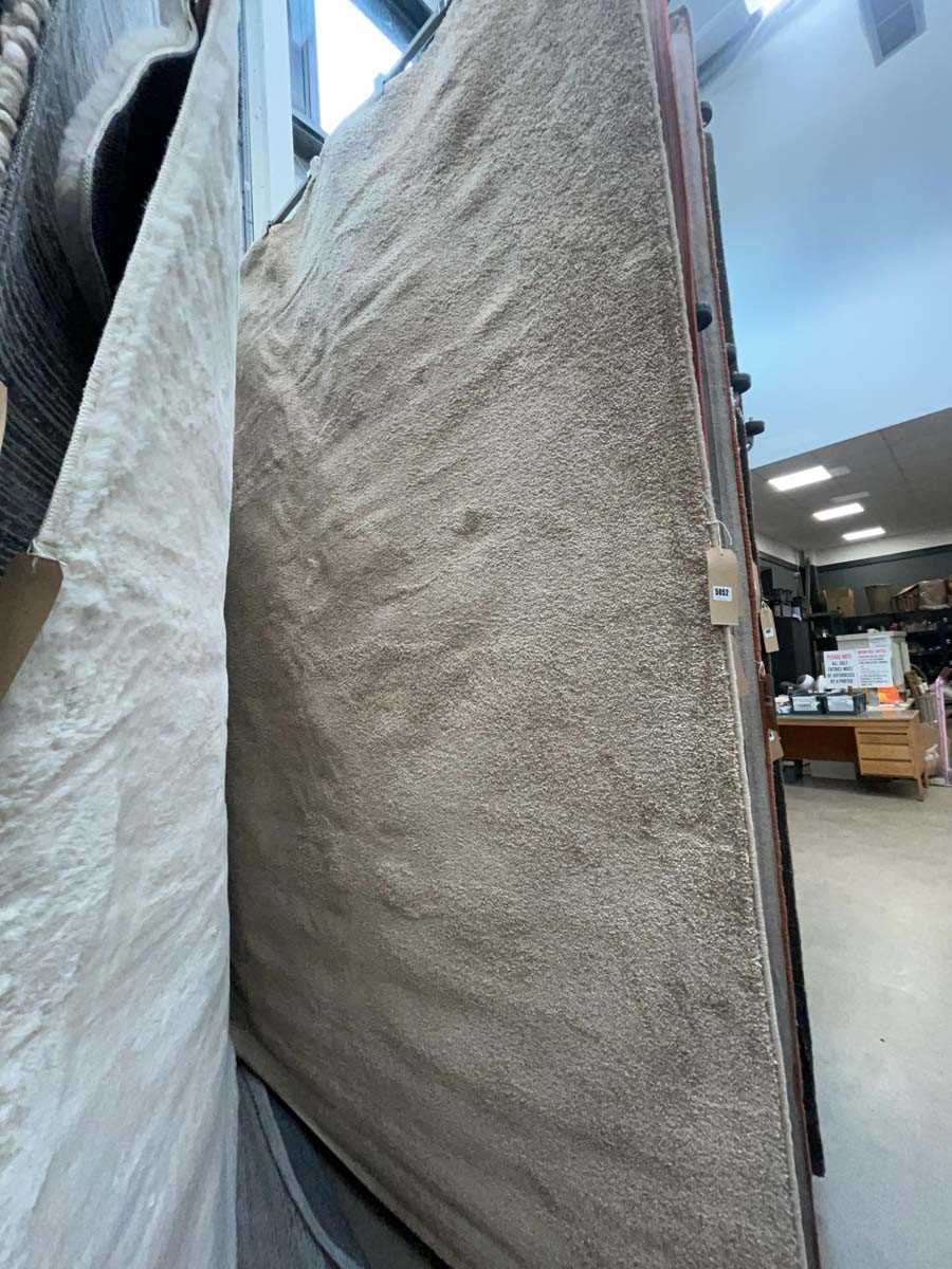 Lot 5052 - Large modern rug in beige