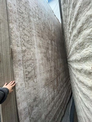 Lot 5053 - Large modern rug in beige and faded green