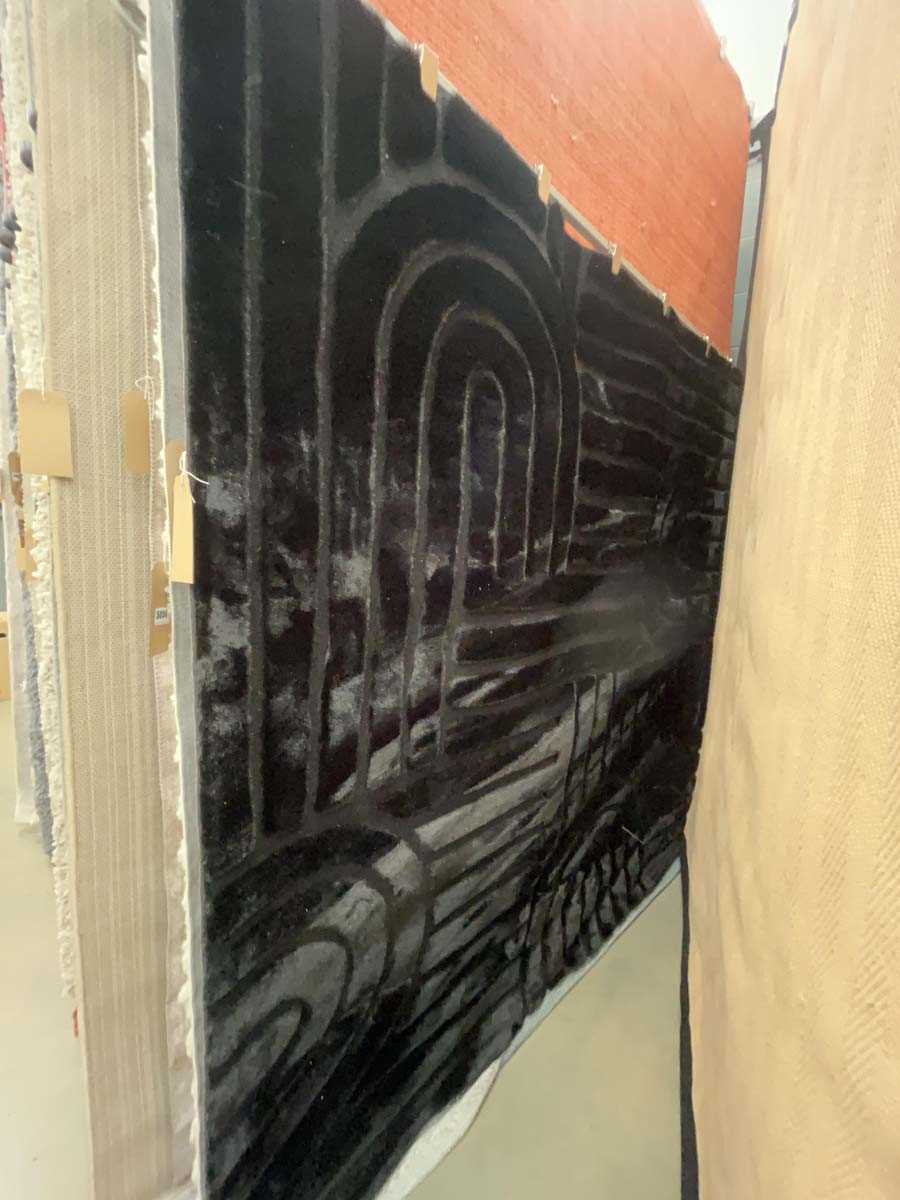 Lot 5056 - Medium sized faux fur rug in jet black