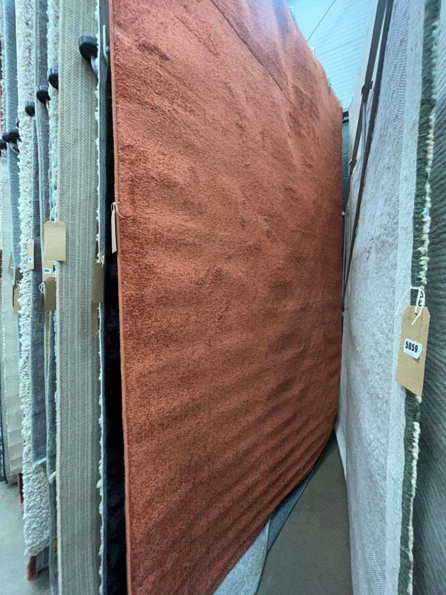 Lot 5058 - Large modern rug in rusty orange colour