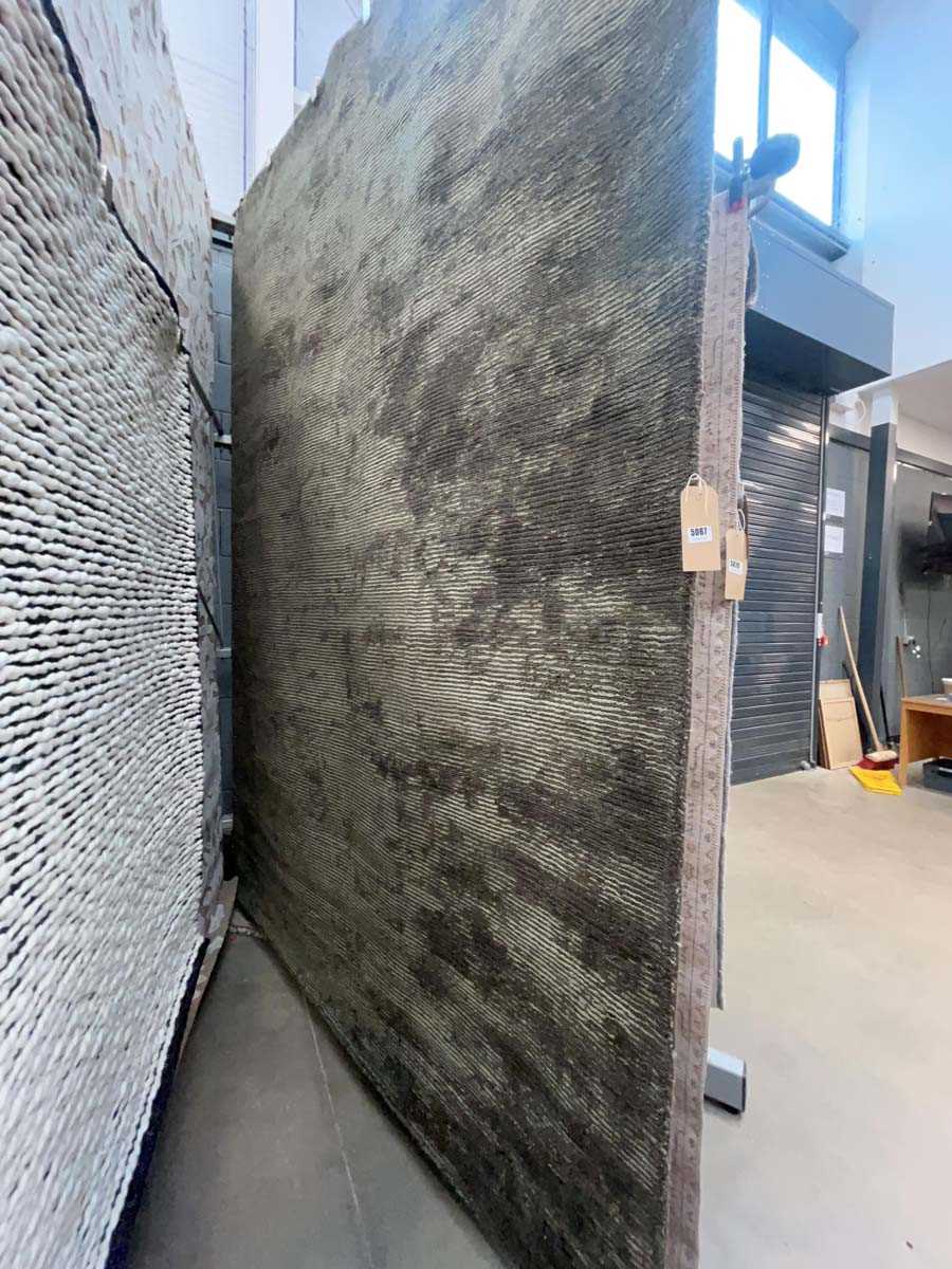 Lot 5067 - Large modern rug in green