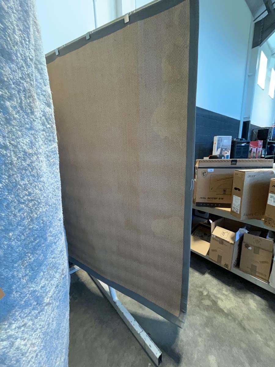 Lot 1302 - Natural fibre rubber backed area rug with grey...