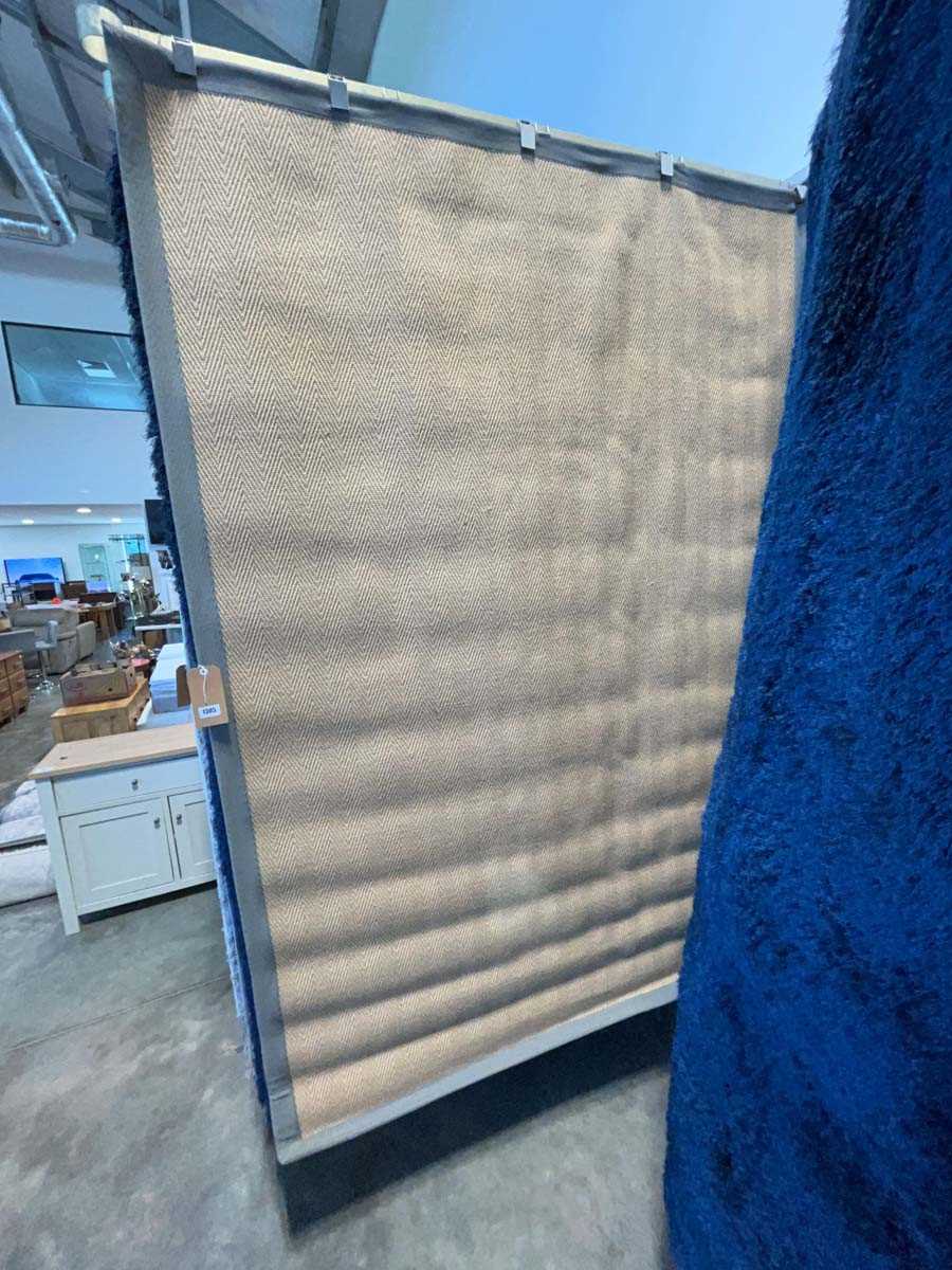 Lot 1305 - Natural fibre rubber backed area rug with grey...