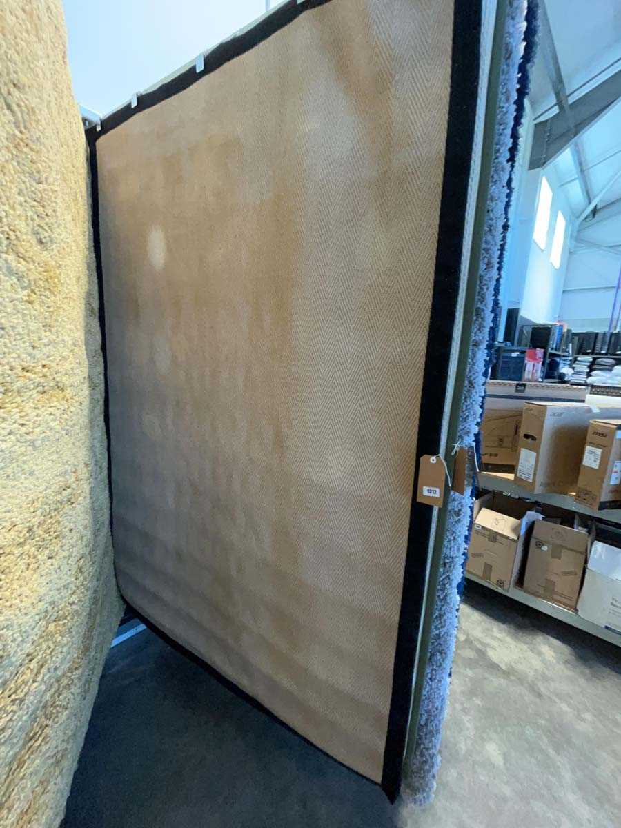 Lot 1312 - Natural fibre rubber backed area rug with...
