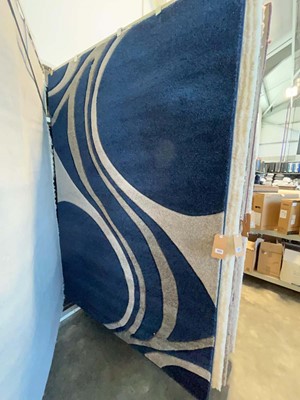 Lot 1322 - Blue and grey patterned area rug, approx. size...