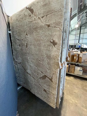 Lot 1325 - Thick pile white and brown area rug, approx....