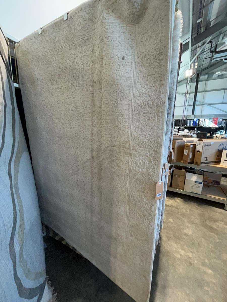 Lot 1328 - Traditional style textured white area rug,...