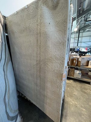 Lot 1328 - Traditional style textured white area rug,...