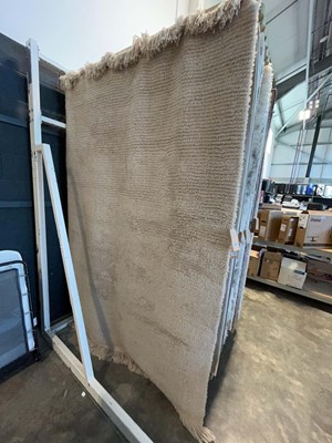 Lot 1331 - Thick pile natural wool tasseled area rug,...