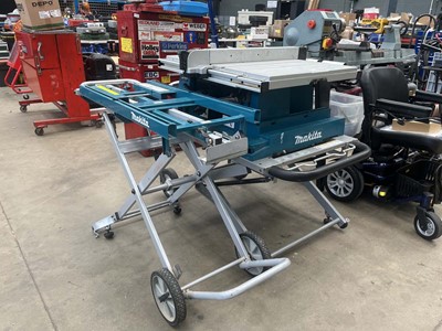 Lot 4517 - Makita table saw plus stand and Makita...