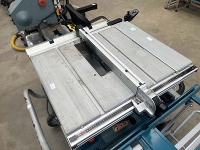 Lot 4517 - Makita table saw plus stand and Makita...