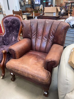 Lot 5345 - Leather armchair on ball and claw supports