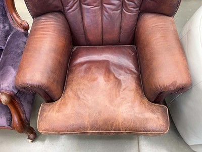 Lot 5345 - Leather armchair on ball and claw supports