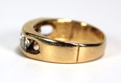 Lot 699 - A 14ct yellow gold ring set three princess cut...