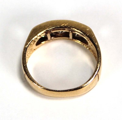 Lot 699 - A 14ct yellow gold ring set three princess cut...