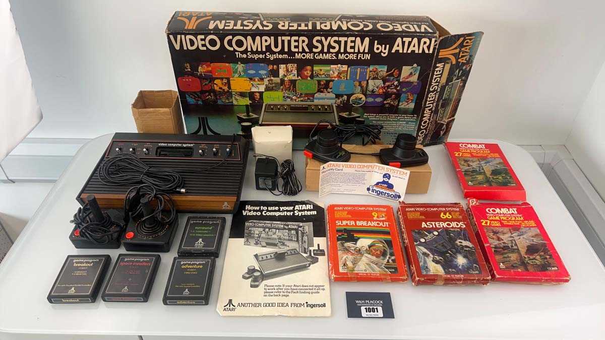 Lot 1001 - Atari 2600 in box together with 8 game cartridges