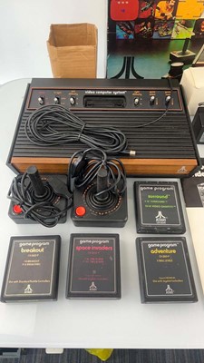 Lot 1001 - Atari 2600 in box together with 8 game cartridges