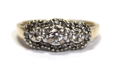 Lot 700 - A 14ct yellow gold ring set small diamonds in...
