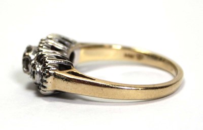 Lot 700 - A 14ct yellow gold ring set small diamonds in...