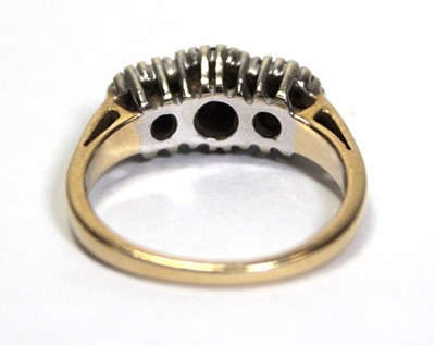 Lot 700 - A 14ct yellow gold ring set small diamonds in...