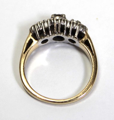 Lot 700 - A 14ct yellow gold ring set small diamonds in...