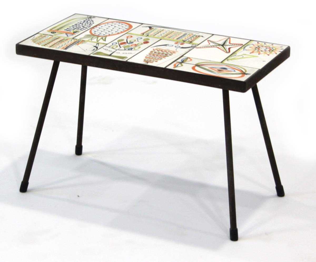 Lot 59 - A 1950/60's occasional table, the surface set...